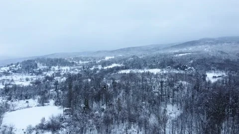 Aerial view of snowcapped mountain in winter season. Snowy valley . Stock Footage 233282383