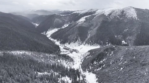 Aerial view of snowy forests and deep canyons in Western Sichuan Stock Footage 332552268