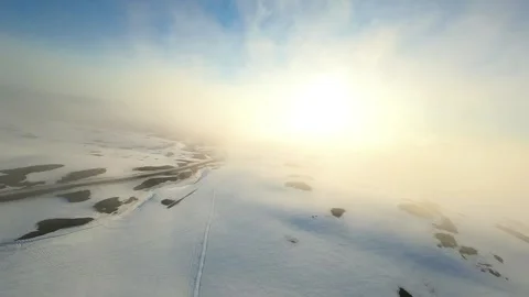Aerial View of Snowy Landscape with Forest Islands Stock Footage 341609375