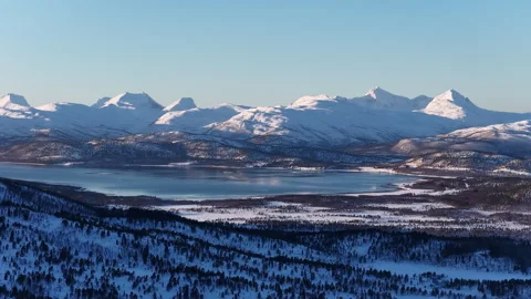 Aerial view of snowy mountain range and frozen lake, Norway Stock-Footage 340427334