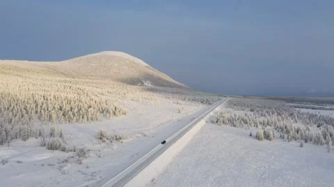 Aerial view of snowy road and landscape, Russia. Stock Footage 313935341