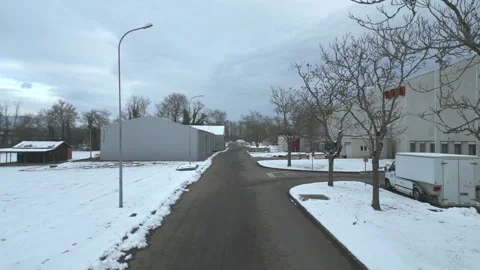 Aerial View of a Snowy Road Inside CERN Stock Footage 261566482