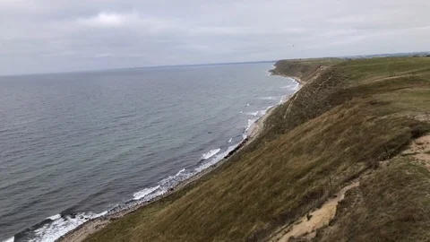 Aerial View Of Soaring Beach Cliff While Paragliding, Southern Sweden Stock Footage 117905435