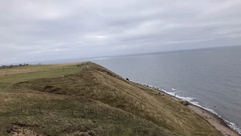 Aerial View Of Soaring Beach Cliff While Paragliding, Southern Sweden Stock Footage 117905482