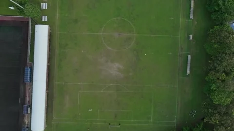 Aerial view of a soccer field with benches and goal posts captured during a Stock Footage 312913853