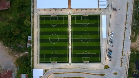 Aerial view of soccer team practicing on soccer field in top view 動画素材 94594824