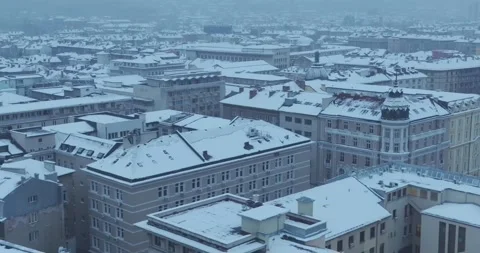 Aerial view of Sofia city with snowy homes and buildings Stock Footage 297786206