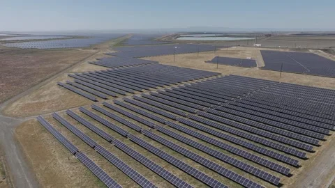 Aerial view of solar array in dry barren arid environment Stock Footage 303044604