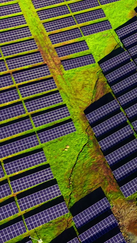 Aerial view of solar array with small stream Vertical video. Stock Footage 332347032