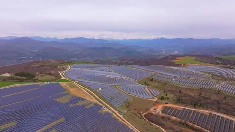 Aerial view of solar cells capturing energy in an open rural setting Stock Footage 310688319