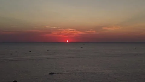 Aerial view of a solar eclipse over the sea with boats Vídeos de archivo 343325671