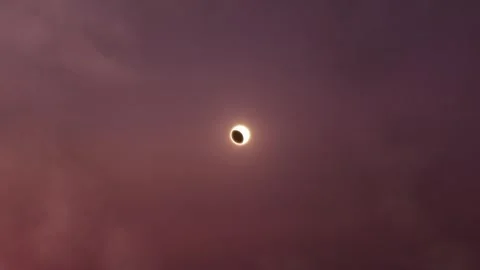 Aerial View of a Solar Eclipse at Sunset 動画素材 305768956