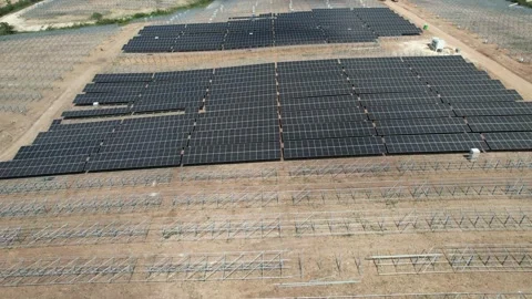 Aerial view of a solar farm with dense panel rows on flat terrain Stock Footage 278368154