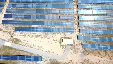 Aerial view of a solar farm generating green energy Stock Footage 338196963