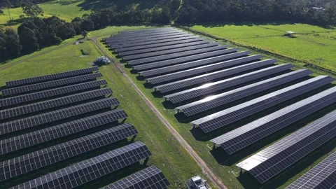 Aerial view of a solar farm generating renewable energy Stock Footage 341270339