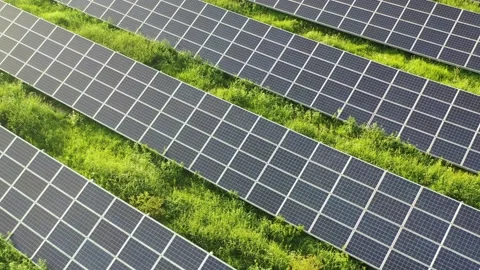 Aerial view of a solar farm producing clean renewable sun energy Stock Footage 157440161
