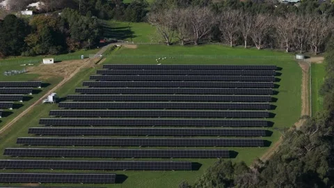 Aerial view of a solar farm producing renewable energy Stock Footage 341267896