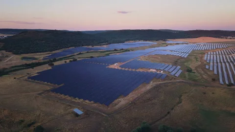 Aerial view of a solar farm producing clean renewable energy Stock Footage 344759506