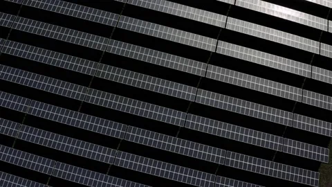 Aerial view of a solar farm. Rows of modern photovoltaic solar panels. Renewable Stock Footage 142601741