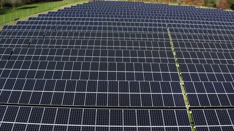 Aerial view of a solar farm. Rows of modern photovoltaic solar panels. Renewable Stock Footage 142661673