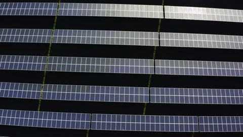 Aerial view of a solar farm. Rows of modern photovoltaic solar panels. Renewable Stock Footage 142689552