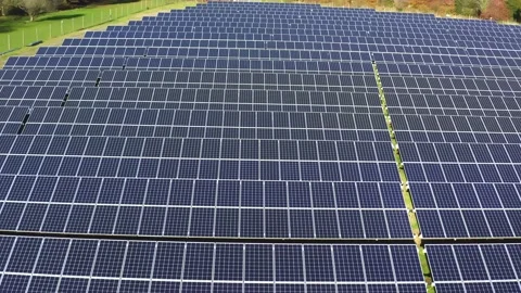 Aerial view of a solar farm. Rows of modern photovoltaic solar panels. Renewable Stock Footage 142748797