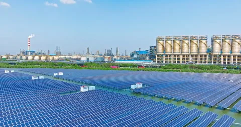 Aerial view of solar panel and industrial buildings in industrial areas Stock Footage 228597742