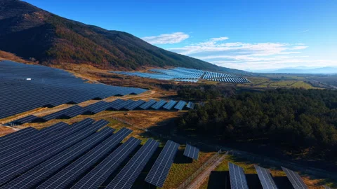 Aerial view of solar panel array near mountain forest Video stock 328993044