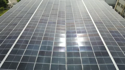 Aerial view of solar panel array with sunlight reflection, China. Stock-Footage 333324572