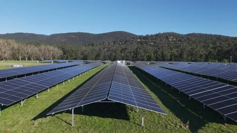Aerial View of Solar Panel Array in The Basin, Melbourne Amid Scenic Green Hills Video stock 342036951