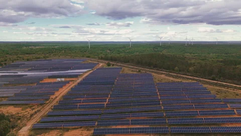 Aerial view of solar panel farm and wind turbines generating renewable energy Stock Footage 336214048