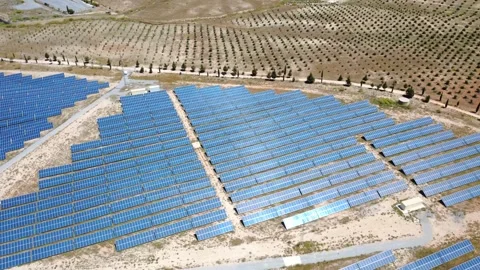 Aerial view of a solar panel farm generating renewable energy Видео 338197000