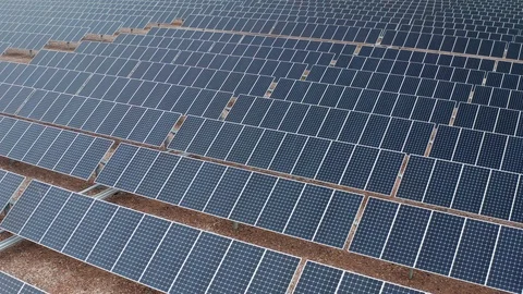 Aerial view of a solar panel grid at a photovoltaic power station in Nevada Stock Footage 121818727