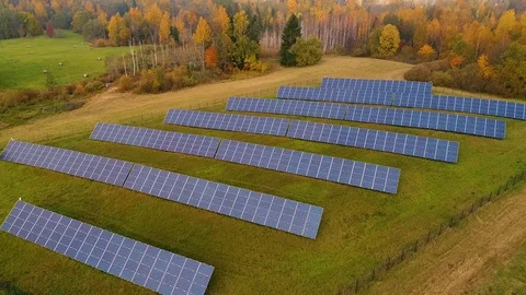 Aerial view of solar panel rows near a forest during Autumn, Estonia. Stock Footage 101569353