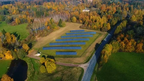 Aerial view of solar panel rows during strong sunlight, Estonia. Stock Footage 101569474