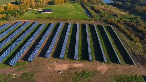 Aerial view of solar panel rows near a forest during Autumn, Estonia. Stock Footage 101570108