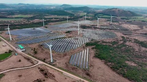 Aerial view of solar panels and wind turbines in Jeju Island Stock Footage 296408525