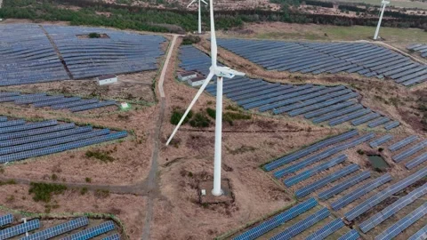 Aerial view of solar panels and wind turbines in Jeju Island Stock Footage 296430279