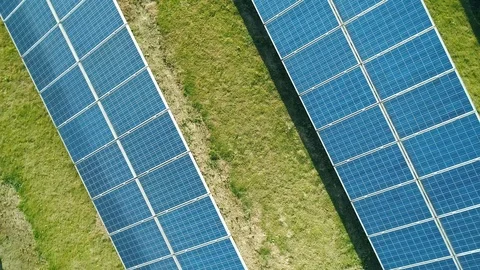 Aerial view of Solar Panels Farm (solar cell) with sunlight. Drone flight over Stock-Footage 108830053