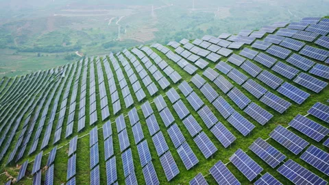 Aerial View of Solar Panels on Green Hillside Agrivoltaics Concept Stock Footage 337184953