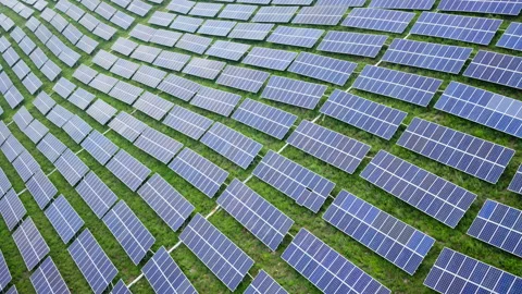 Aerial View of Solar Panels on Green Hillside Agrivoltaics Concept Stock Footage 337185140