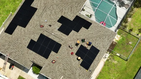 Aerial view of solar panels installation on typical american house roof for Stock Footage 231317099