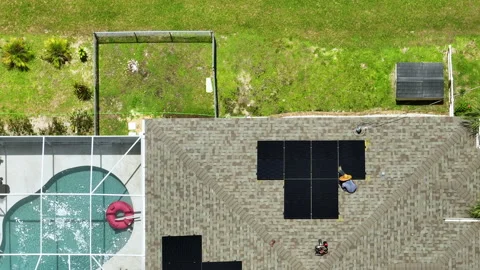 Aerial view of solar panels installation on typical american house roof for Stock Footage 234115625