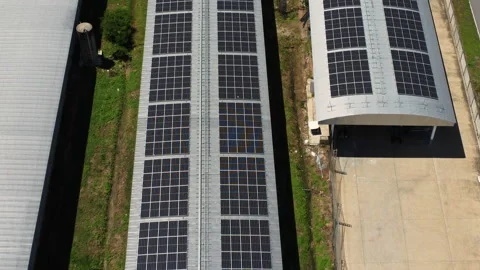 Aerial view of Solar panels installed on a roof of a large industrial building. Stock Footage 205364965