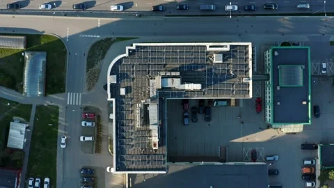 Aerial view of solar panels installed on the roof of a multi-story building Stock Footage 275433468