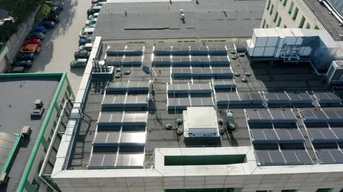 Aerial view of solar panels installed on the roof of a multi-story building Stock Footage 275433584