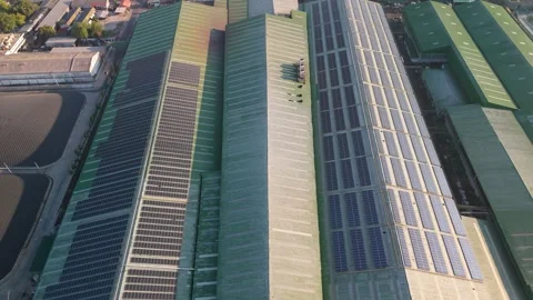 Aerial view of solar panels installed on a factory rooftop Stock Footage 295960000