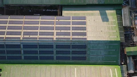 Aerial view of solar panels installed on a factory rooftop Stock Footage 295960021