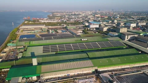 Aerial view of solar panels installed on a factory rooftop Stock Footage 295960023