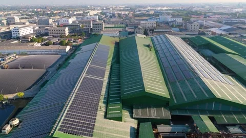 Aerial view of solar panels installed on a factory rooftop Stock Footage 295960413